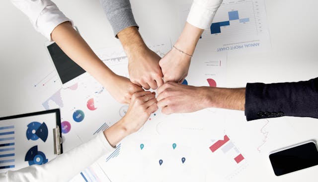 all hands in the middle